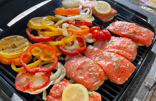 Salmon and Peppers on a grill