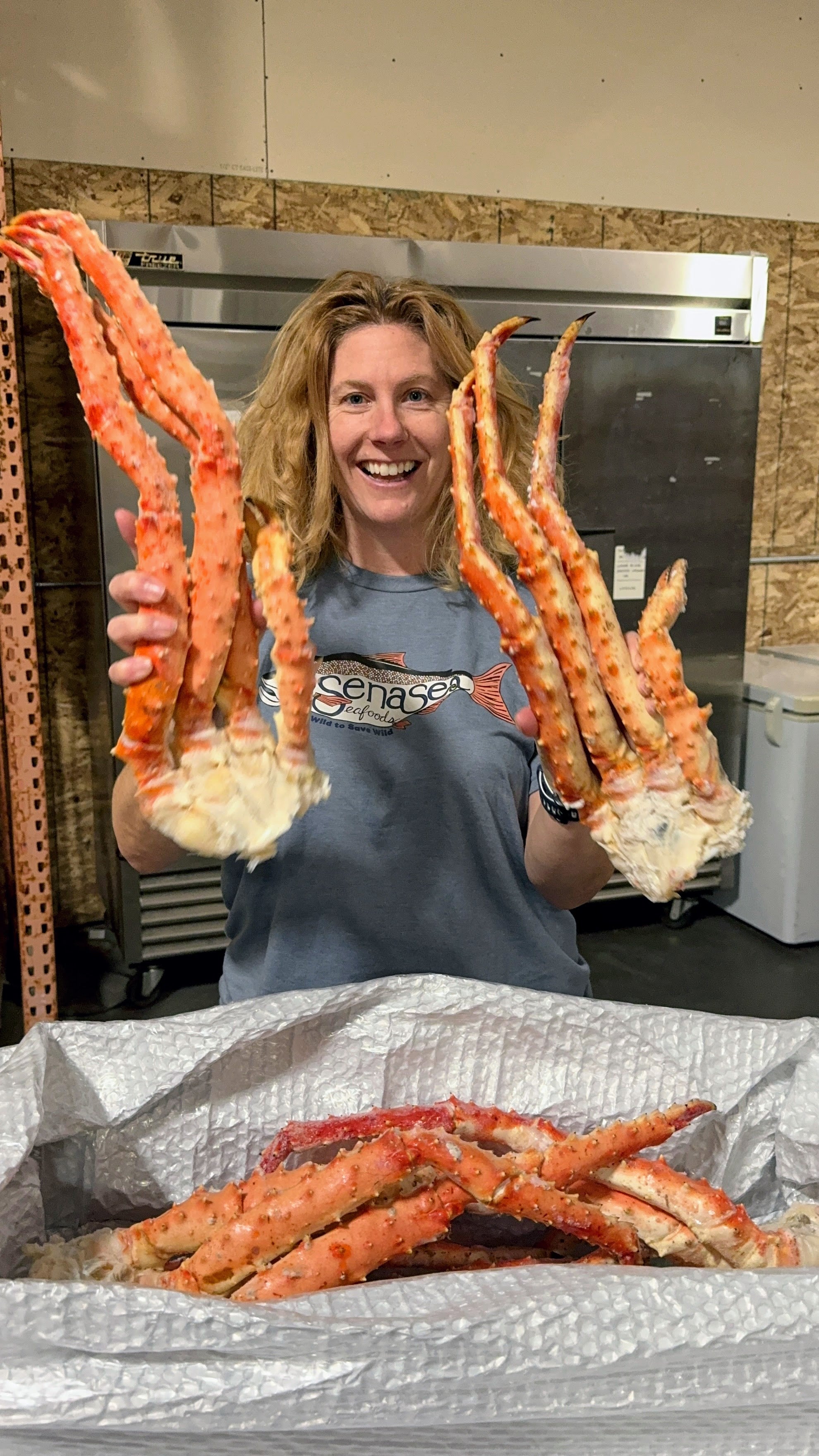 Sena holding large king crab legs