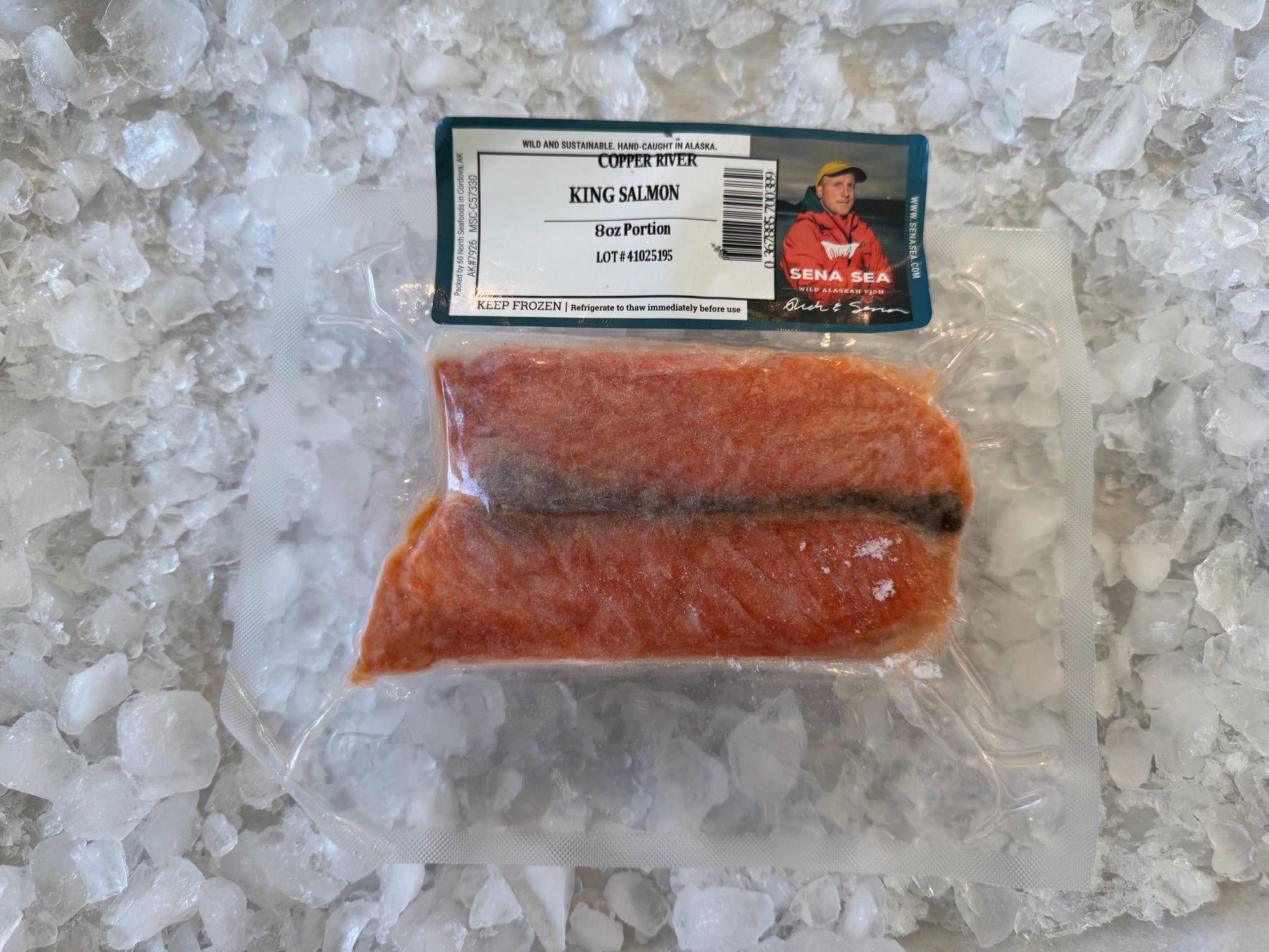 Packaged copper river king salmon on a bed of ice with a label on top
