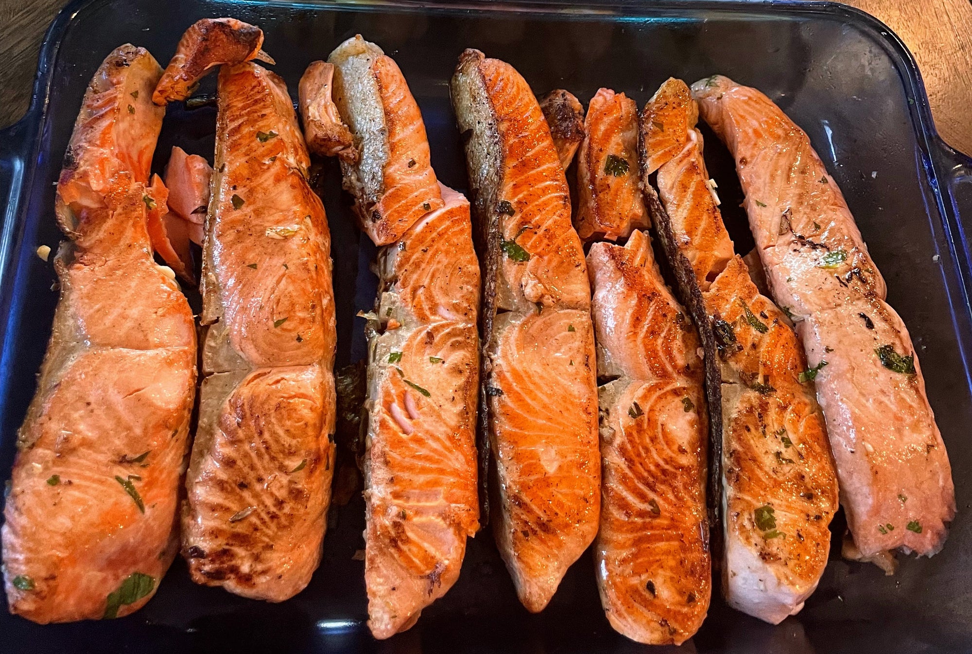 Copper River king salmon fillets on a baking tray.