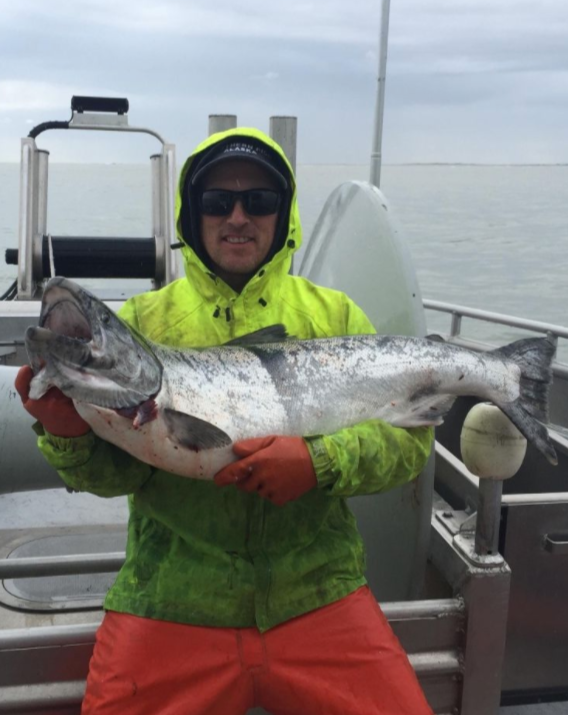 Rich Wheeler, Sena Sea Fisherman with live Copper River Salmon on Fishing Boat