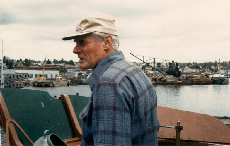 Nostalgic film photography photo of Sena's father on their fishing boat - Image links to Page about Sena Sea's History