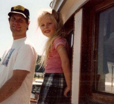 Image of Sena when she was a child and her father on the fishing boat
