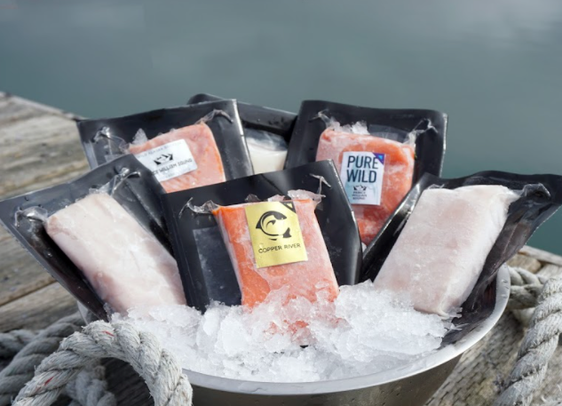 Packaged and frozen Assortment of Sea Sea fish displayed on a doc in crushed ice - Image Links to Products available for Subscription 