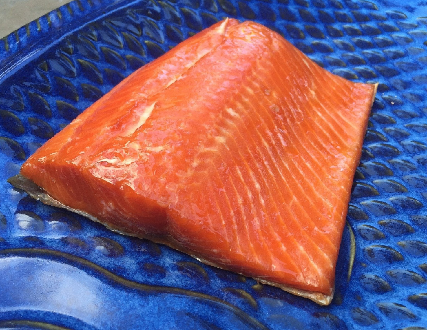 smoked copper river coho salmon on a blue plate